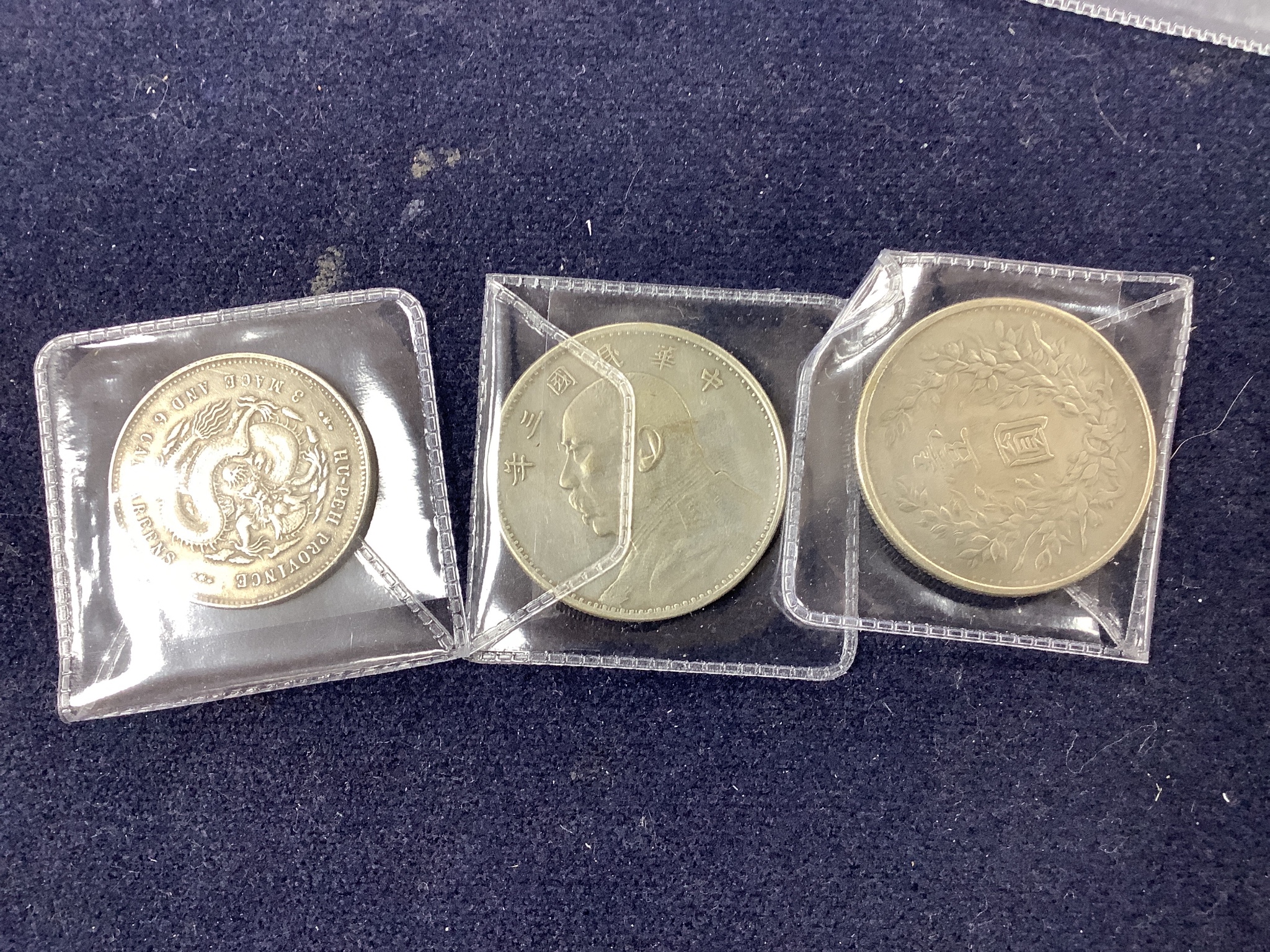 A collection of Chinese coins, stamps and two Japanese banknotes